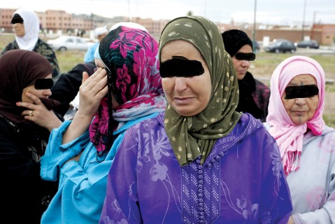 Women mourn the death of Bouzidi, a Moroccan waiter at Argana cafe who was killed during a bomb explosion at the cafe in Marrakesh's Jamaa el-Fnaa square